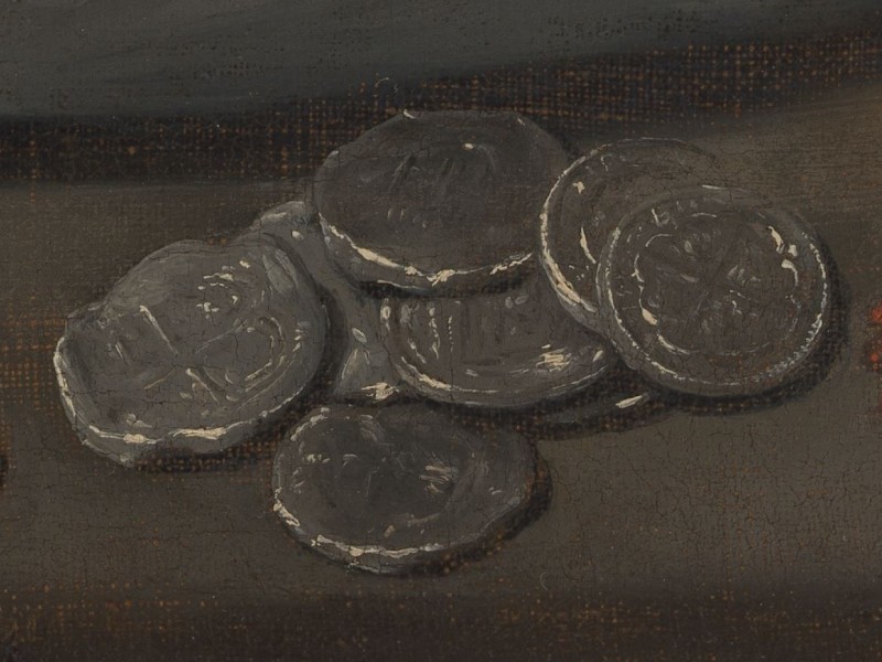 A stack silver coins on a table
