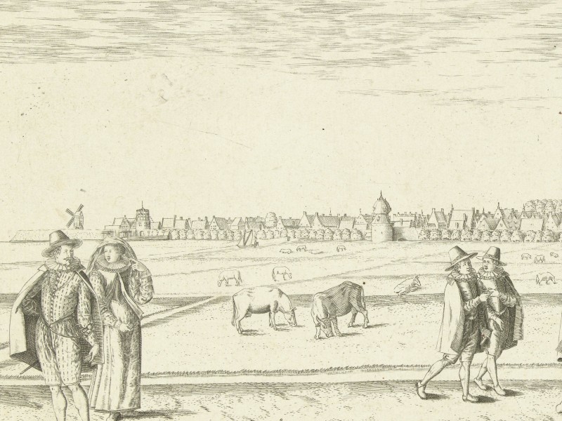 Panorama of Franeker featuring people dressed in local dress in the foreground.