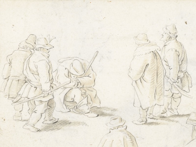 A group of four men standing and talking to a fifth, seated man.